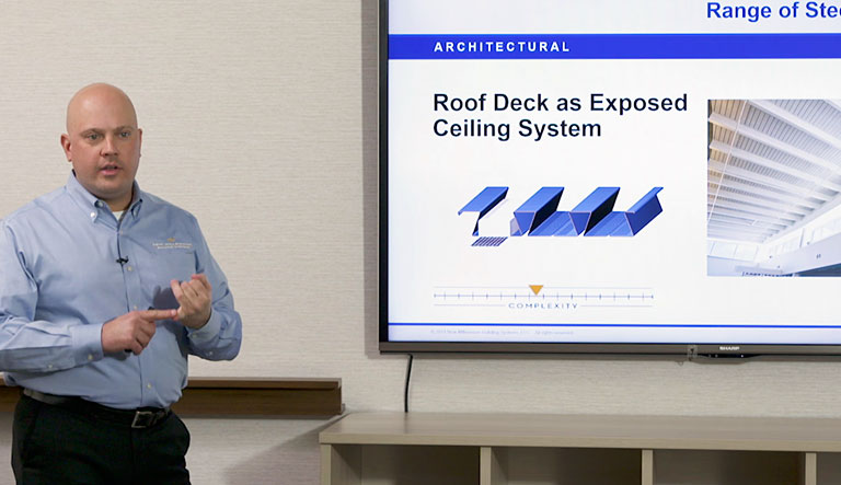 Sean Smith showing Roof Deck Exposed Ceiling System in ppt presentation Joe Buntyn pointing to presentation Online credit hour courses 